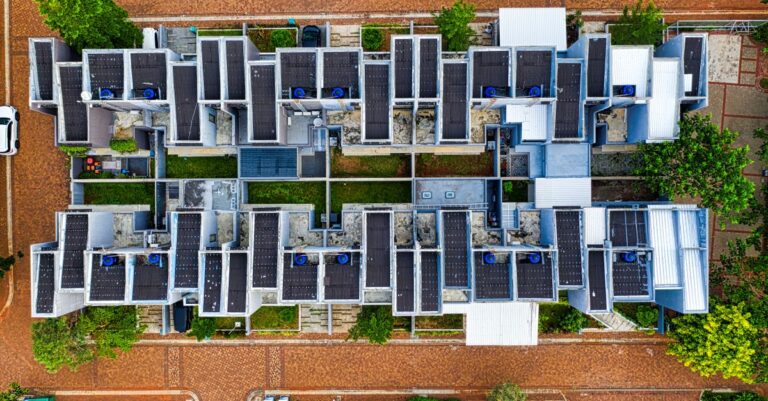 Drone shot of an organized residential area in Banten, Indonesia with solar panels.